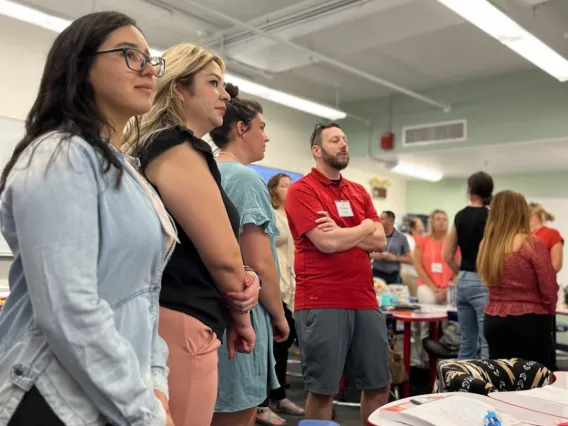 Micheal Perkins guiding a group of teachers