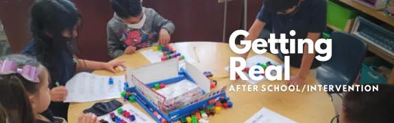 group of students in a learning environment with the getting real logo visible on top